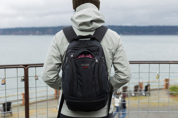 A person wearing a Synapse 19 at a Seattle shoreline.